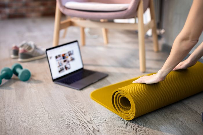 person rolling yoga map