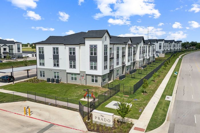 Apartment homes with private backyards at The Prado apartments in Del Valle, TX