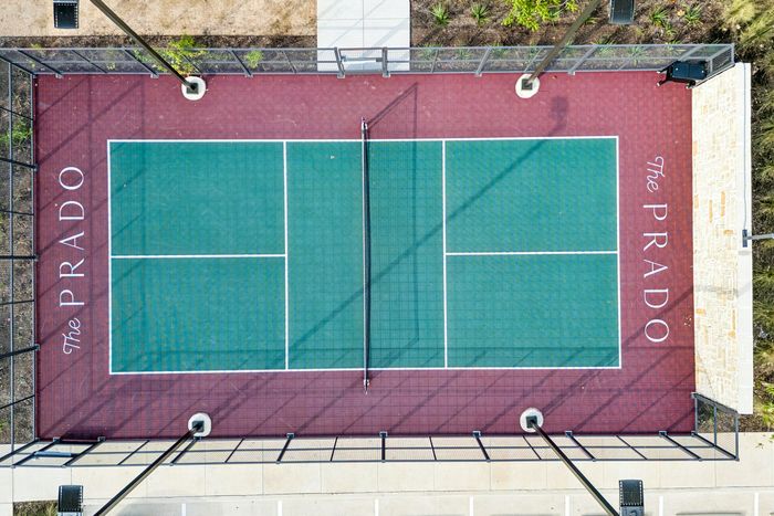 Aerial view of pickleball court at The Prado apartments in Del Valle, TX