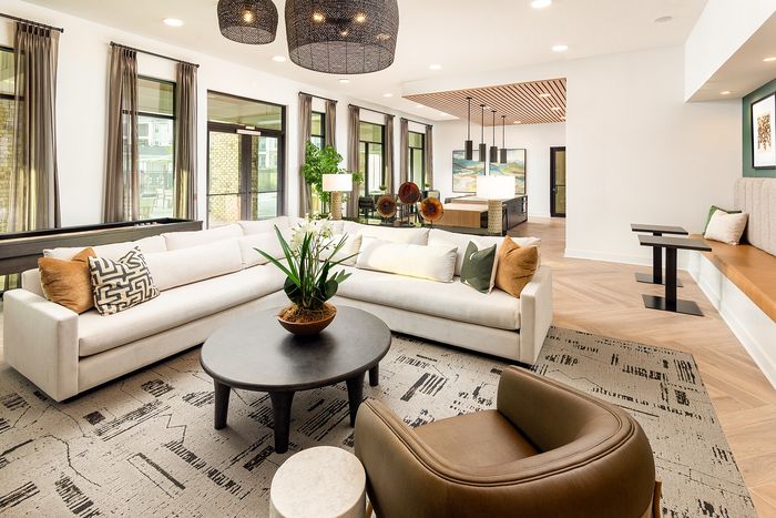 Stylish apartment community resident lounge with comfortable seating and contemporary furnishings.