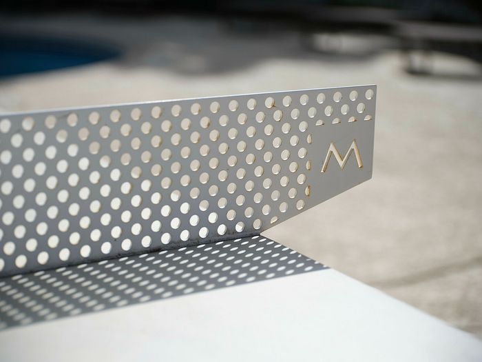 Chic metal architectural detail with perforated design and elegant shadow play.