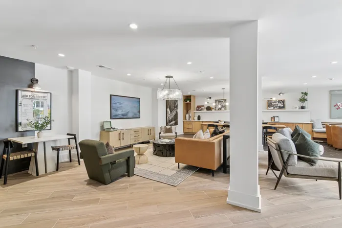 Bright, modern living area featuring elegant furnishings, cozy seating, and stylish decor perfect for relaxation and socializing.