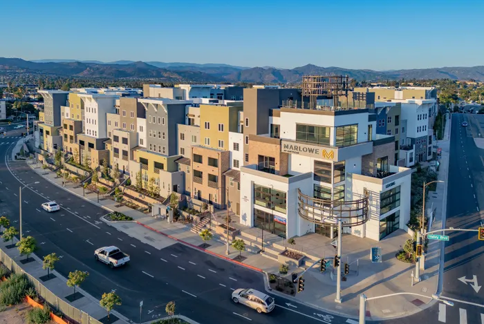 Modern building with contemporary architecture and scenic mountain views at Marlowe Palomar Heights Escondido townhomes.