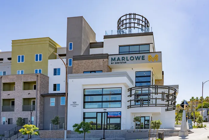 Modern apartment complex showcasing an elegant design with spacious balconies and expansive windows at Marlowe by Greystar.