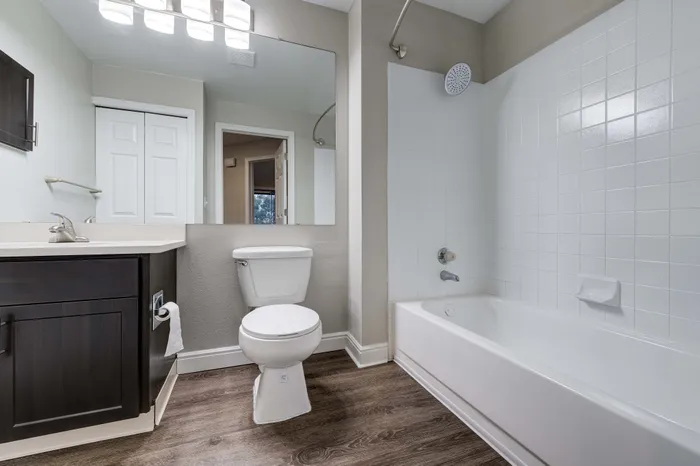 Modern apartment with in-unit laundry featuring a laundry closet with washer and dryer, perfect for convenient living.