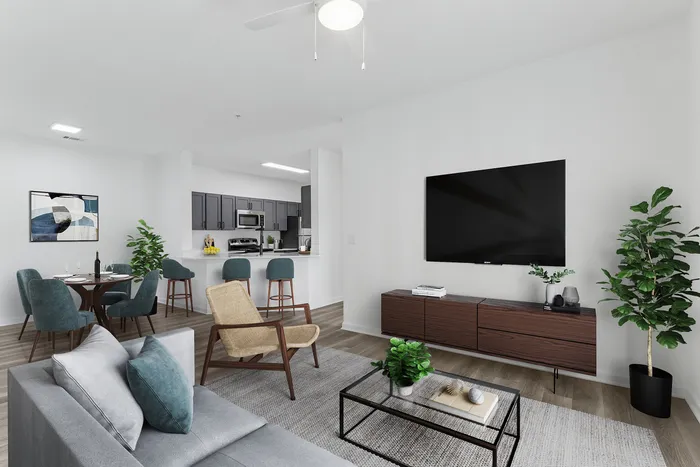 Contemporary open-plan living room with cozy seating, stylish dining area, and modern kitchen in a bright, welcoming space.