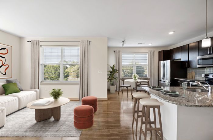 Modern living space with open-concept design, featuring a sleek kitchen, stylish dining area, and cozy living room with contemporary decor.