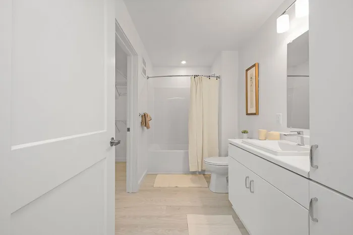 Modern bathroom with sleek cabinetry, elegant fixtures, and calming neutral tones.