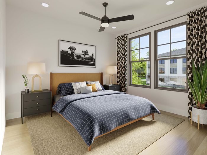 Inviting bedroom with stylish decor, featuring a large bed, chic side tables, modern artwork, and expansive windows offering a bright and airy ambiance.