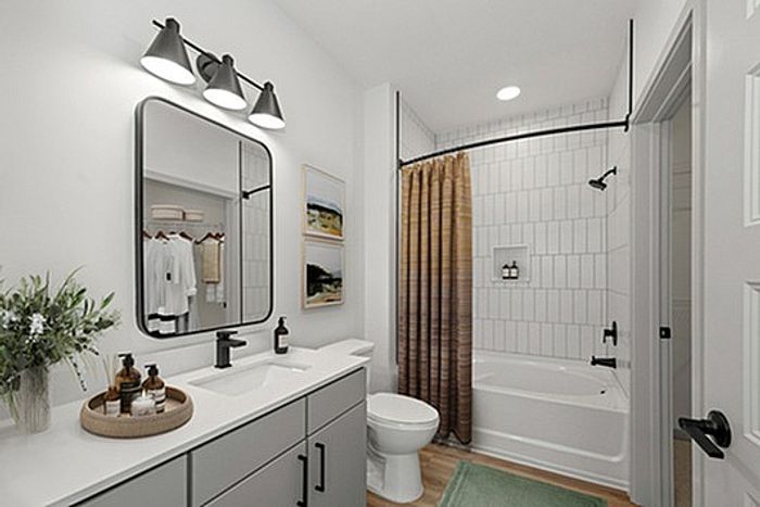 Chic bathroom with modern vanity, elegant lighting, and upscale finishes.