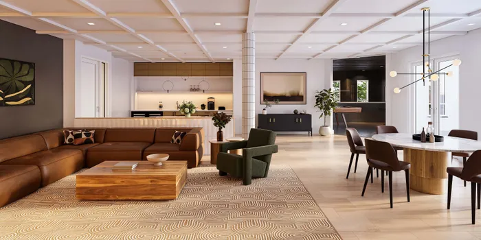 Elegant open-concept clubroom with a plush leather sofa, modern dining area, and sleek kitchen featuring a chic chandelier and stylish decor.
