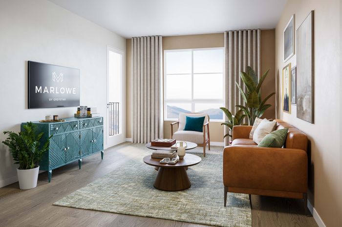 Chic living room with modern decor, featuring a cozy leather sofa, stylish turquoise cabinet, and floor-to-ceiling windows offering breathtaking views.