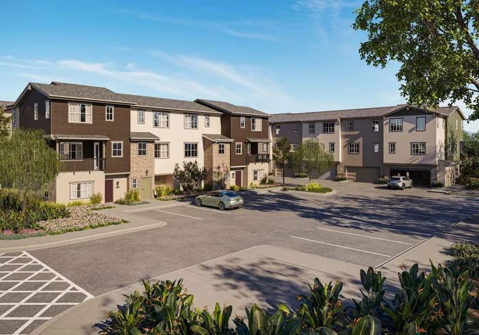 Modern townhome exteriors featuring attached garages