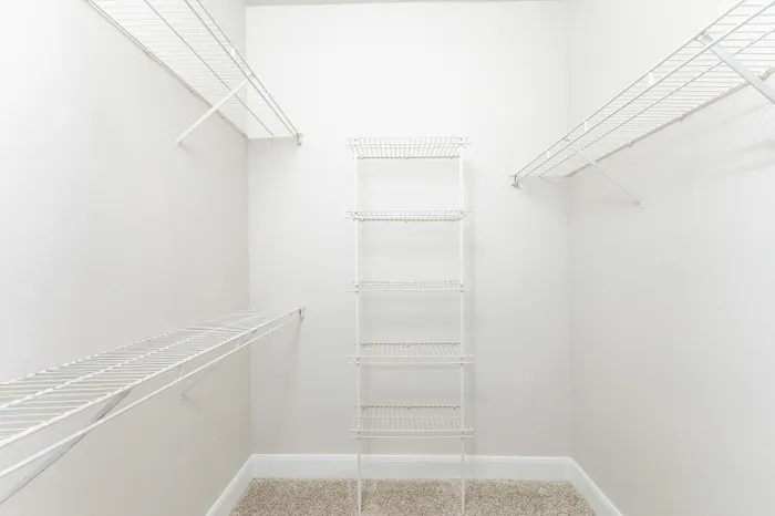 Spacious closet featuring sleek wire shelving, perfect for organized storage.