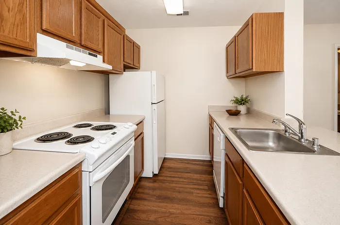 Inviting kitchen with sleek countertops, modern appliances, and warm wooden cabinetry, perfect for culinary enthusiasts.