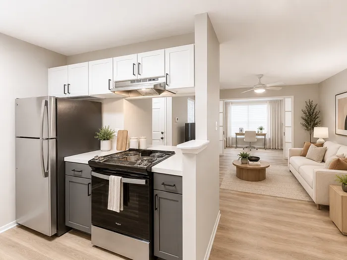 Modern apartment showcasing a sleek kitchen with stainless steel appliances, open-plan living area with stylish decor, and bright home office space.