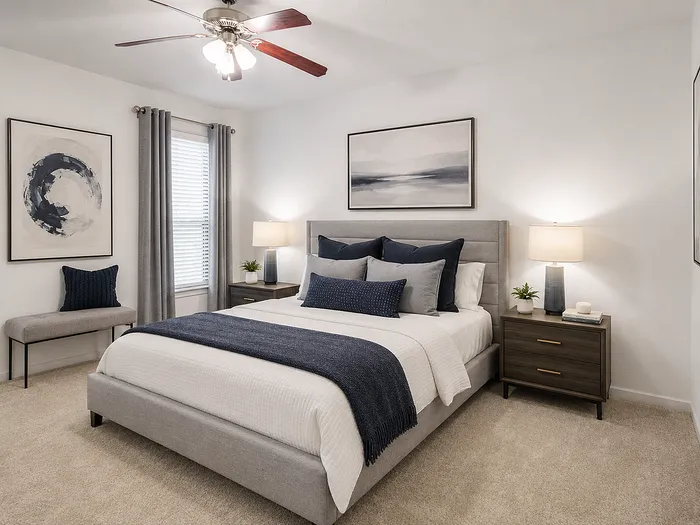 Inviting bedroom with plush queen bed, stylish decor, and soft ambient lighting, creating a cozy retreat.