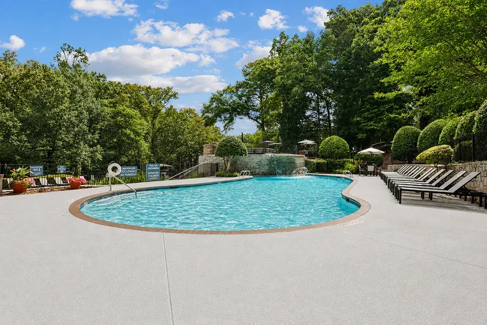 Outdoor pool with loungers at Avana Cumberland in Atlanta, Georgia.