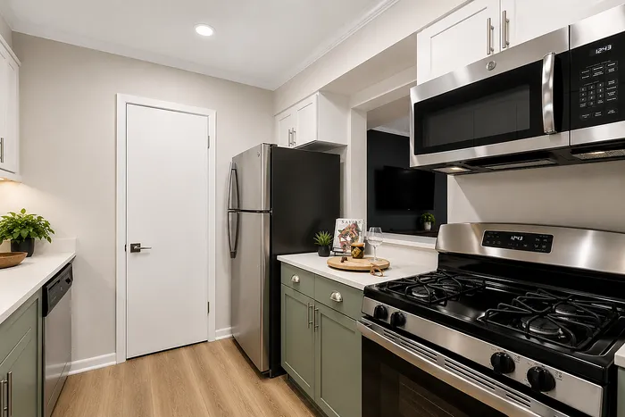 Modern apartment kitchen with stainless steel appliances at Avana Cumberland in Atlanta, GA.