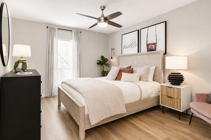 Elegant apartment bedroom with modern decor at Avana Cumberland in Atlanta, GA.