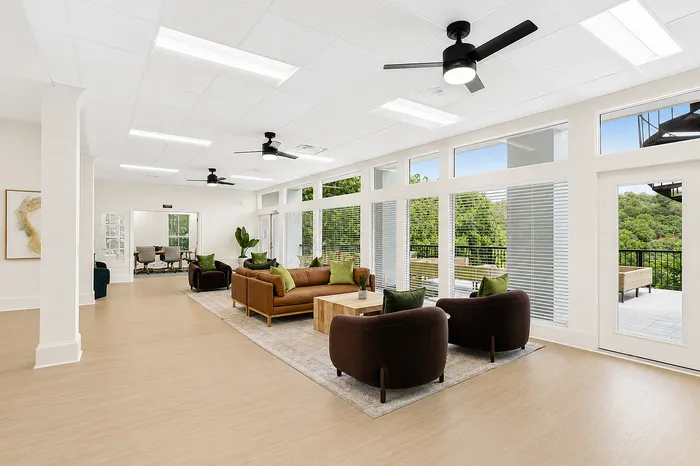 Spacious clubhouse living area with scenic views at Avana Cumberland in Atlanta, GA.