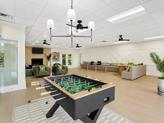 Recreation room with foosball table at Avana Cumberland in Atlanta, GA.