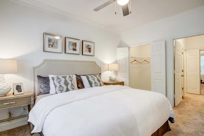 Inviting bedroom with plush king-size bed, elegant bedside tables, and chic wall art, offering a cozy and stylish retreat.
