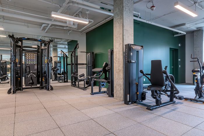 Modern fitness center equipped with cutting-edge exercise machines, offering a sleek and motivating environment for workouts.
