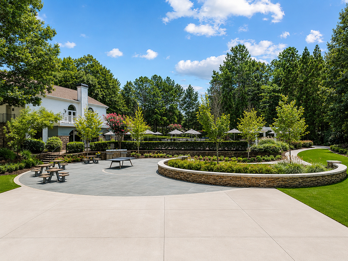Social lawn with ping pong, picnic tables, grills and outdoor dining at Avana TownPark in Kennesaw, GA