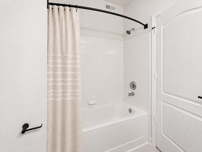 Apartment bathroom with tub and shower at Avana TownPark in Kennesaw, GA