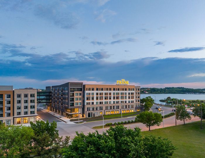 Modern lakeside apartment complex showcasing elegant architecture and expansive views, perfect for stylish urban living.