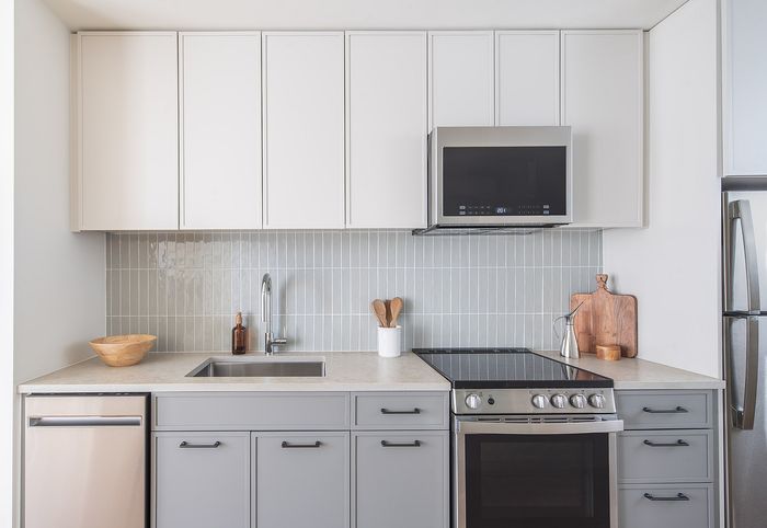 Modern kitchen with sleek cabinetry, stainless steel appliances, and a stylish backsplash design.