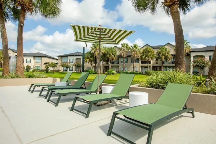 Lounge Chairs overlooking pond and palm trees