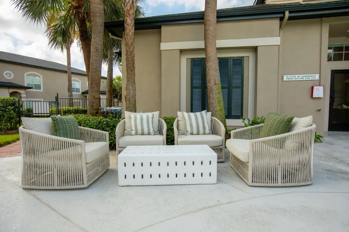 Lounge Chairs overlooking pond and palm trees