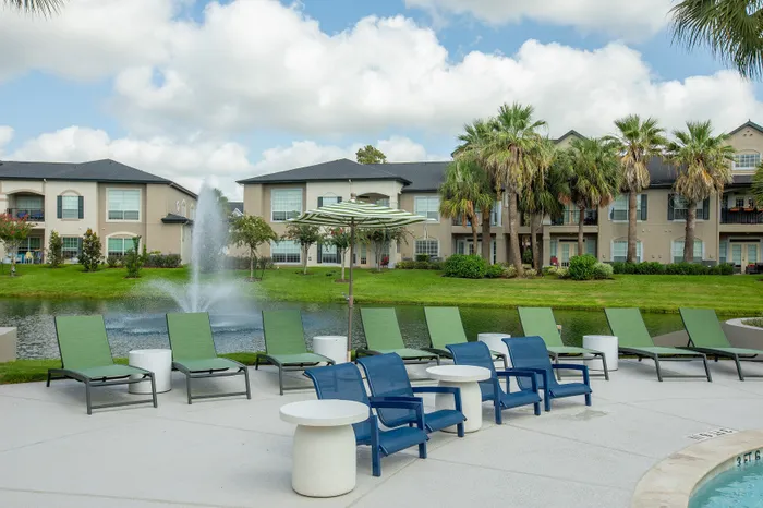 Lounge Chairs overlooking pond and palm trees