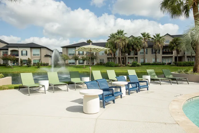 Lounge Chairs overlooking pond and palm trees