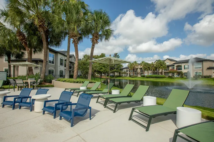 Lounge Chairs overlooking pond and palm trees