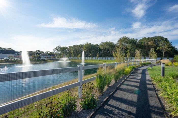Beautiful walking paths around the large water feature with fountains