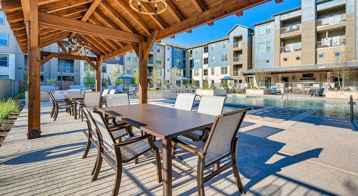 Tables by Swimming Pool