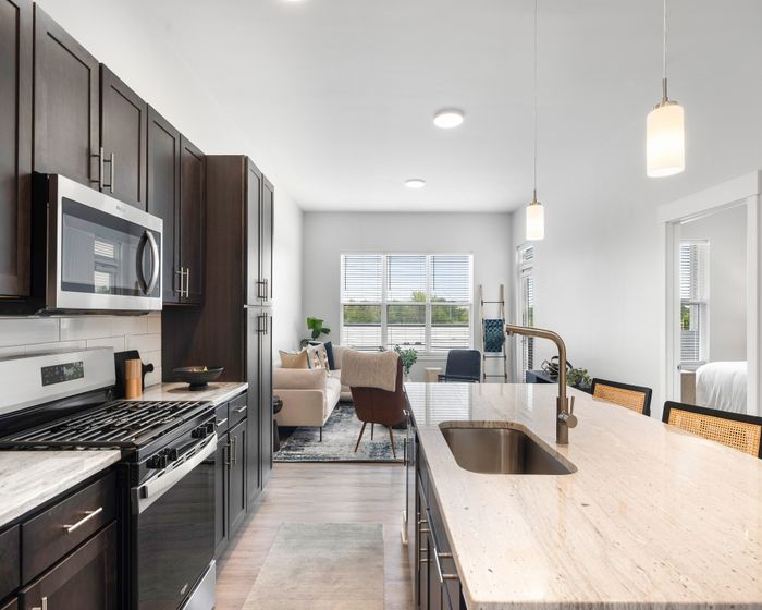 Open-plan kitchen with island and breakfast bar seating