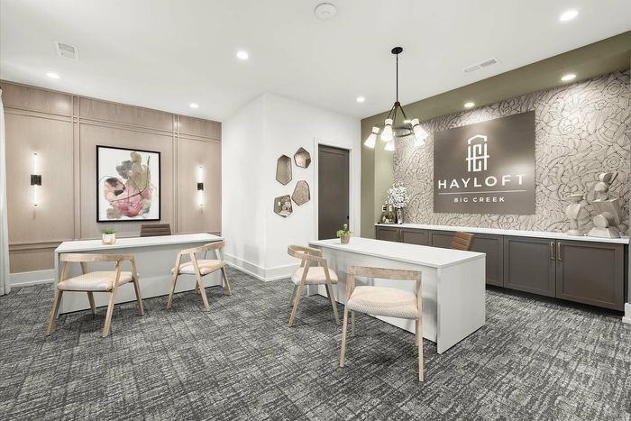 Elegant Hayloft Big Creek leasing office with stylish decor, modern lighting, and contemporary furniture.
