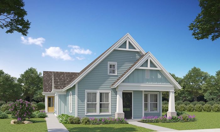 Charming suburban house with a welcoming front porch, surrounded by lush greenery and vibrant flowers, under a clear blue sky.