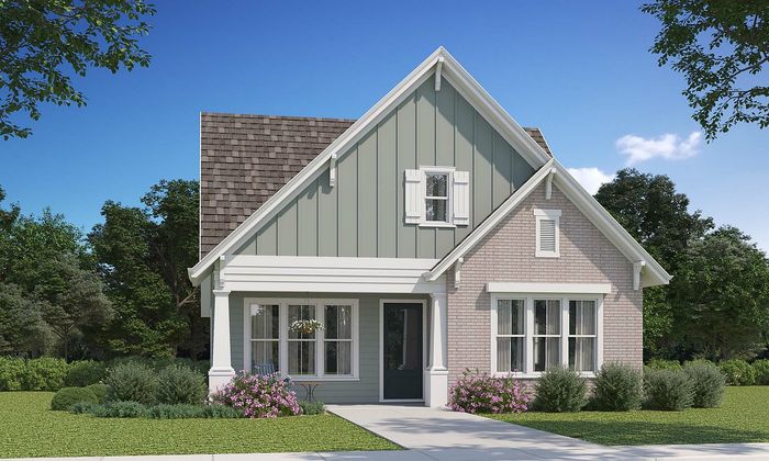 Charming suburban home with elegant gabled roof, surrounded by lush greenery and vibrant flower beds.