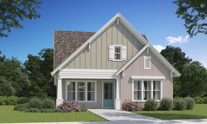 Charming cottage-style home with a picturesque facade, lush greenery, and inviting front porch.
