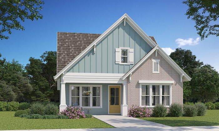 Charming suburban house with a blue and beige exterior, featuring a welcoming yellow door and beautifully landscaped garden.