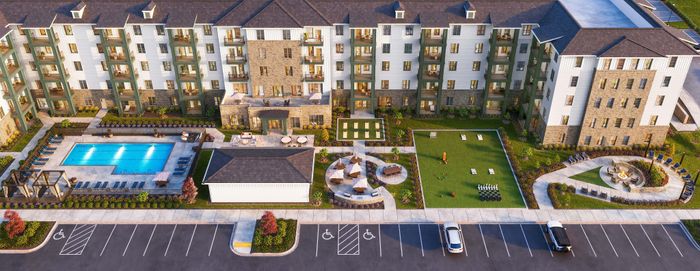 Luxurious apartment complex with a pristine swimming pool, lush green gardens, and inviting outdoor seating, perfect for relaxation and entertainment.