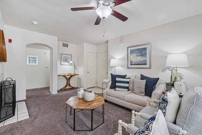 Inviting living room with plush seating, elegant decor, and warm lighting creating a cozy ambiance.