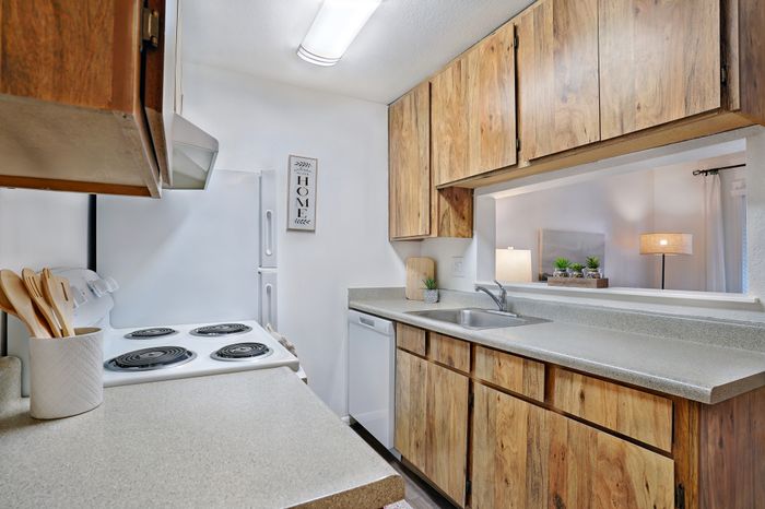 Inviting kitchen with modern appliances and a cozy pass-through window to the living area.