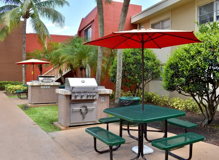 Cherry Grove Village, exterior, picnic tables with umbrellas, palm trees