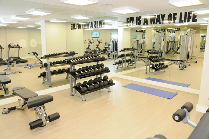 Gables 37 Grand, interior, fitness center, hand weights, large mirrors